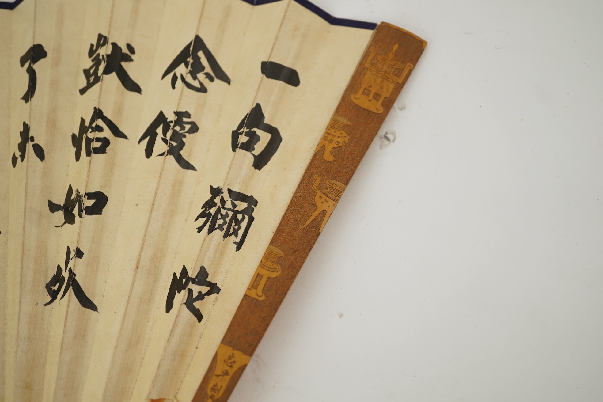 Two Chinese inscribed paper leaf fans, late 19th century